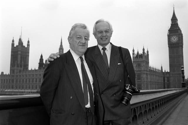 Moncrieff was awarded a CBE in the 1990 New Year Honours - he's pictured alongside PA royal photographer Ron Bell who became an MVO (Member of the Royal Victorian Order)