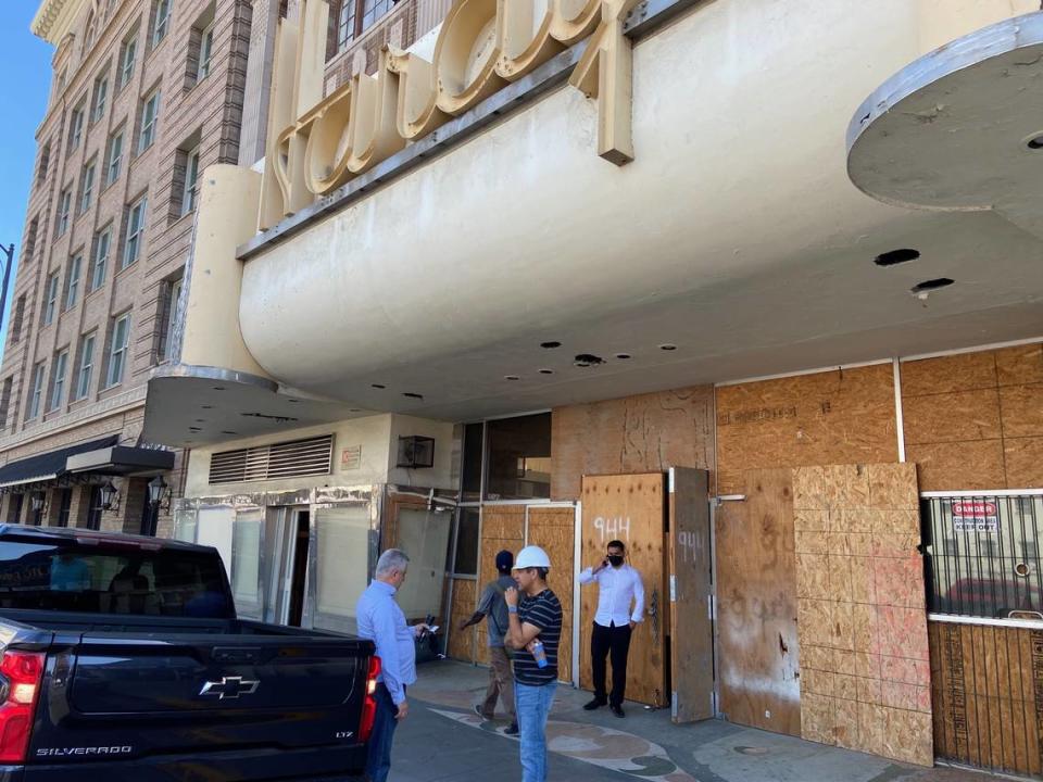 Fresno City Councilmember Miguel Arias (in white hardhat) speaks with the Universal Church project manager for Hardy’s Theater prior to a city inspection of the 106-year-old building April 28, 2023.