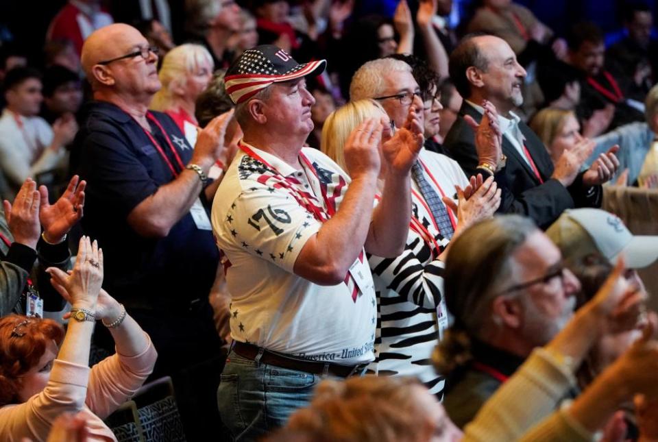 Supporters applaud Mike Pence’s speech on Thursday.