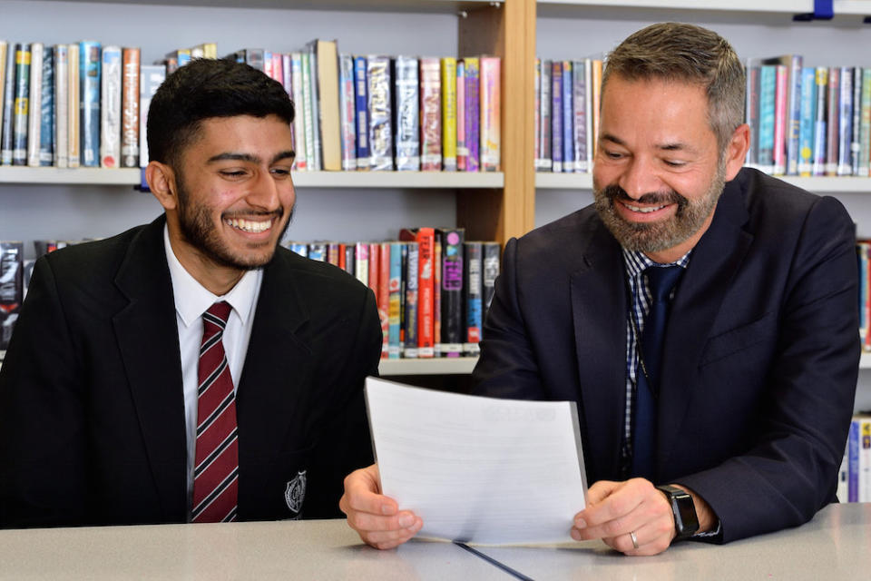 Hasan Patel with George Mitchell headteacher Saeed Hussain (Picture: SWNS)