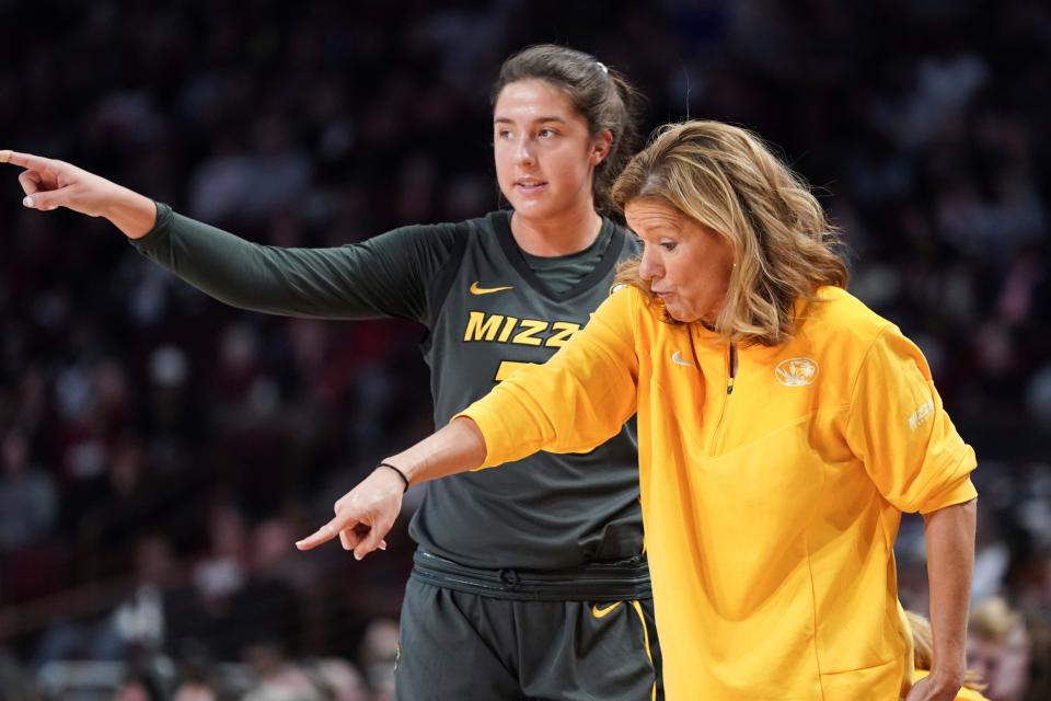 Missouri head coach Robin Pingeton, right, and Sarah Linthacum talk during a break in play during the second half of an NCAA college basketball game, Sunday, Jan. 15, 2023, in Columbia, S.C. South Carolina won 81-51.