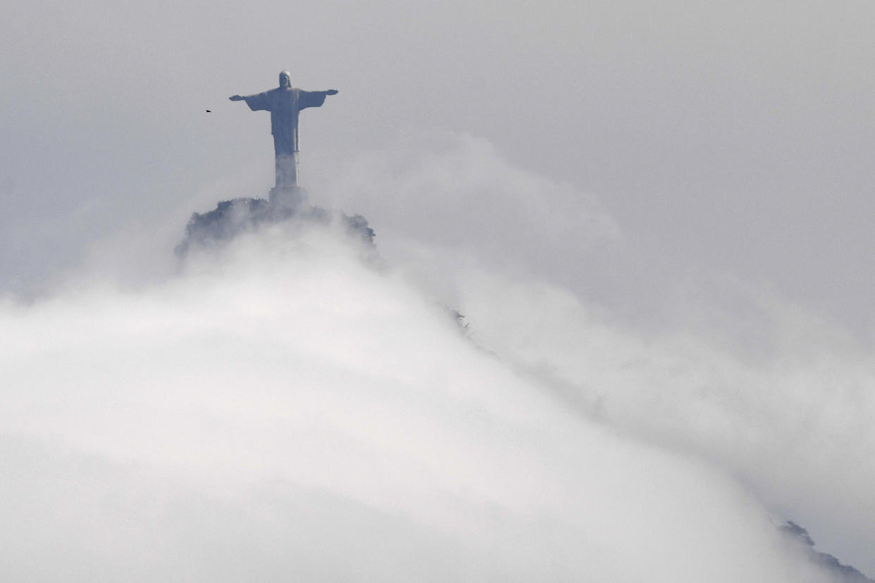 View of the Christ the Redeemer statue, located at the peak of the 700 metre (2,300 ft) Corcovado mountain, taken during the Rio 2016 Olympic Games in Rio de Janeiro on August 9, 2016. (Photo credit: WILLIAM WEST/AFP/Getty Images)