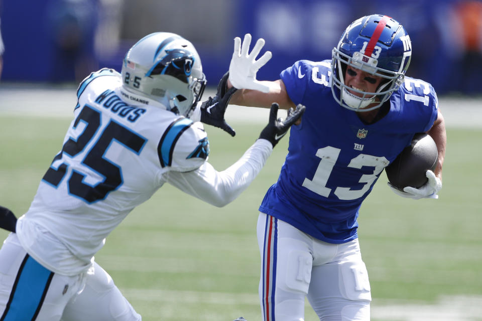 New York Giants' David Sills V, right, fends off Carolina Panthers' Xavier Woods during the first half an NFL football game, Sunday, Sept. 18, 2022, in East Rutherford, N.J. (AP Photo/Noah K. Murray)
