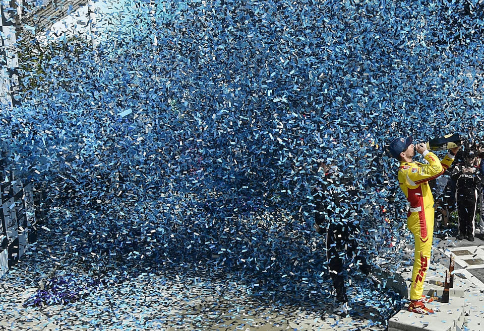 Second place finisher Romain Grosjean drinks champagne as he celebrates in victory lane following the 47th annual Acura Grand Prix of Long Beach on Sunday, April 10, 2022. Josef Newgarden won the race. (Will Lester/The Orange County Register via AP)