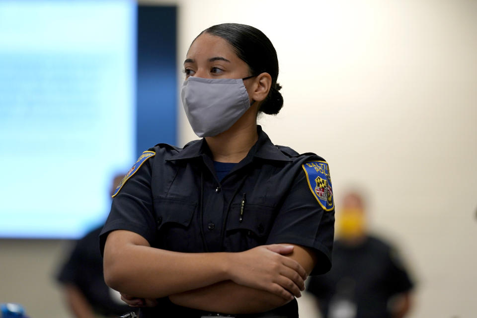 In this Sept. 9, 2020, photo Kaley Garced, a cadet in the Baltimore Police Department, listens to an instructor during a class session focusing on procedural justice in Baltimore. (AP Photo/Julio Cortez)