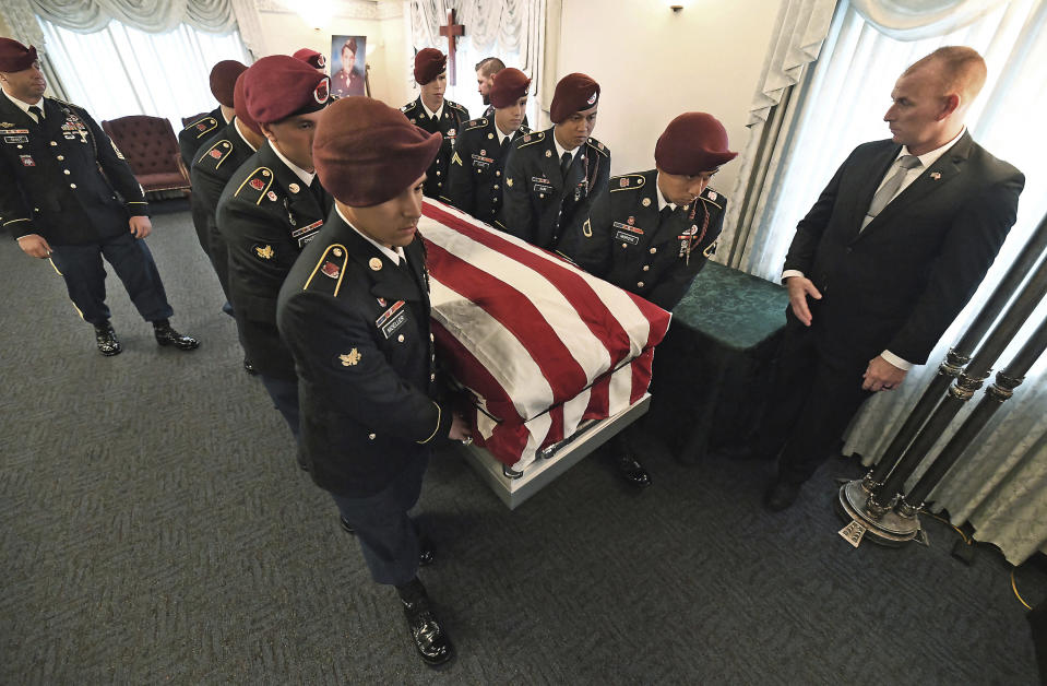 Members of the U.S. Army 18th Airborne Corps, 82nd Airborne Division from Fort Bragg, North Carolina, carry the casket containing the remains of U.S. Army Pfc. paratrooper Willard "Bud" Jenkins of Scranton, Pa., who was killed in action in 1944 during World War II on Wednesday, Sept. 27, 2018, at Edward J. Chomko Funeral Home in Scranton, Pa. ( Butch Comegys / The Scranton Times-Tribune via AP)