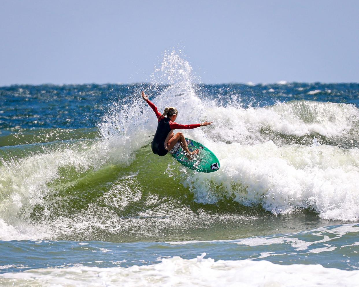 Lanea Mons hits the lip of a wave near the Jacksonville Beach Pier. The 13-year-old local surfing star was first profiled in an October 2020 story.