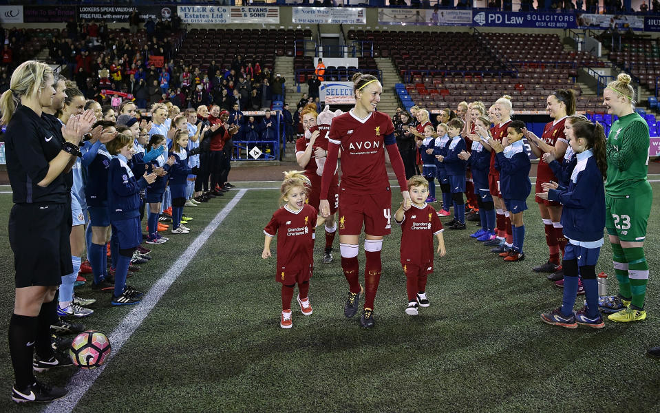 WIDNES, ENGLAND - FEBRUARY 21:  (THE SUN OUT, THE SUN ON SUNDAY OUT) Casey Stoney of Liverpool Ladies walks out to a guard of honour with her three children before the FA WSL match between Liverpool Ladies and Sunderland Ladies at Select Security Stadium on February 21, 2018 in Widnes, England.  (Photo by Andrew Powell/Liverpool FC via Getty Images)