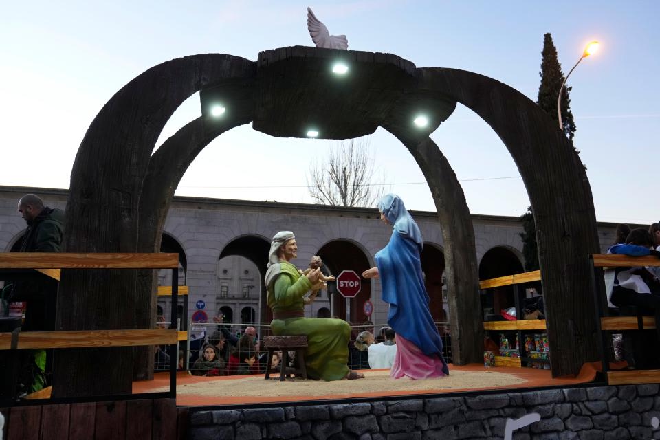 Figures of Joseph, Jesus and Mary are paraded during the "Cabalgata de Reyes" Epiphany parade in Madrid, Spain, Thursday, Jan. 5, 2023. Tens of thousands of adults and children are packing city and town sidewalks across Spain to watch colorful parades on the eve of the Epiphany, the day Christians observe the biblical visit of the Three Kings to the baby Jesus.