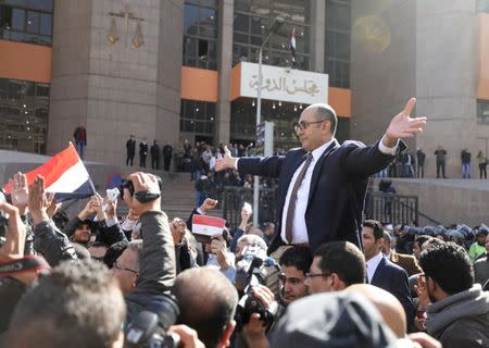 Egyptian lawyer and ex-Presidential candidate Khaled Ali (C), who is marching in support of a ruling against the Egypt-Saudi border demarcation agreement, reacts in front of the State Council courthouse in Cairo, Egypt, January 16, 2017. REUTERS/Mohamed Abd El Ghany