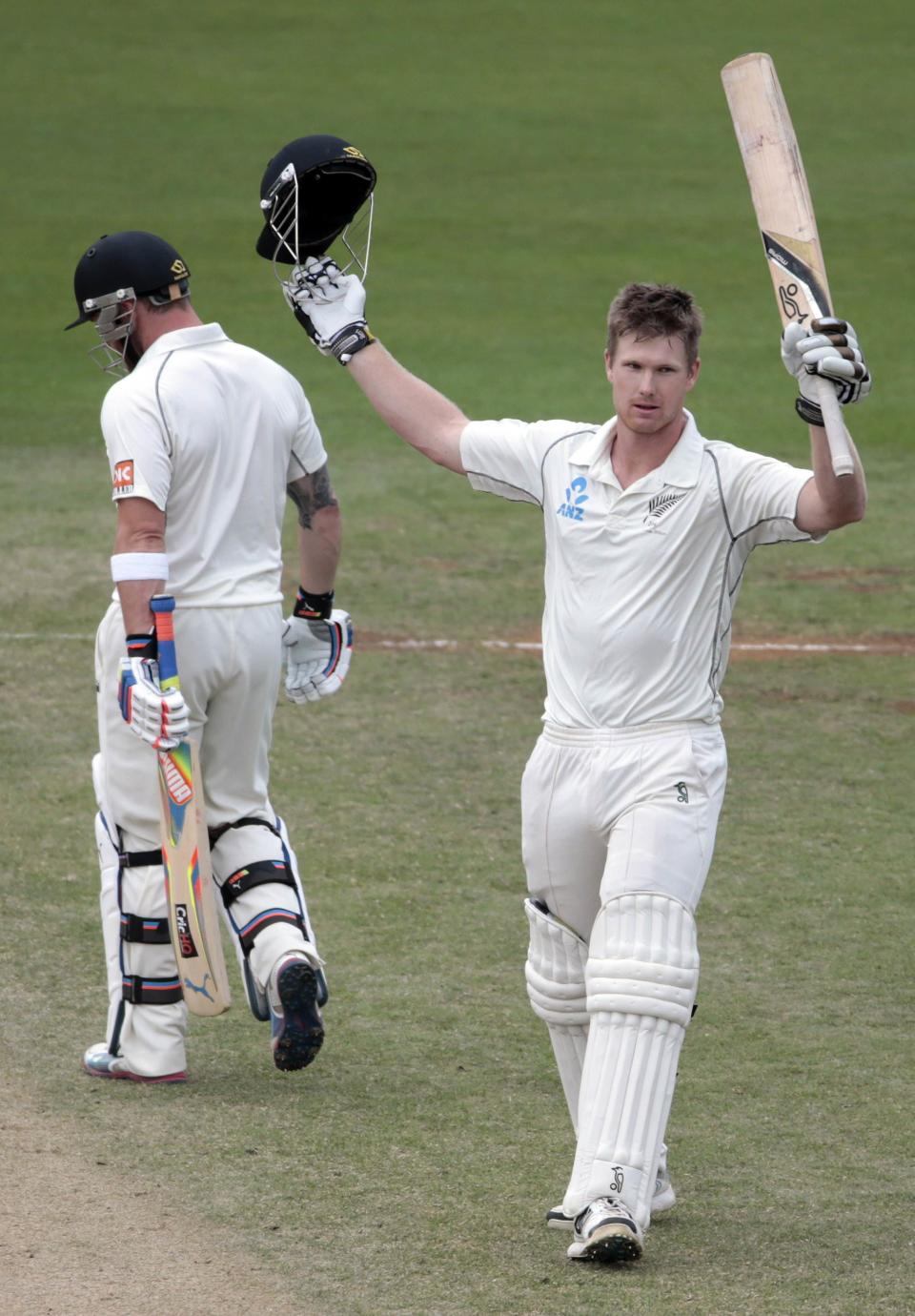 New Zealand's James Neesham (R) acknowledges his 100 against India during the second innings of play on day five of the second international test cricket match at the Basin Reserve in Wellington, February 18, 2014. REUTERS/Anthony Phelps (NEW ZEALAND - Tags: SPORT CRICKET)