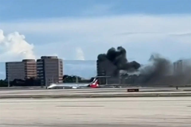 A Red Air flight from the Dominican Republic up in flames after landing at Miami’s International Airport. (NBC News)