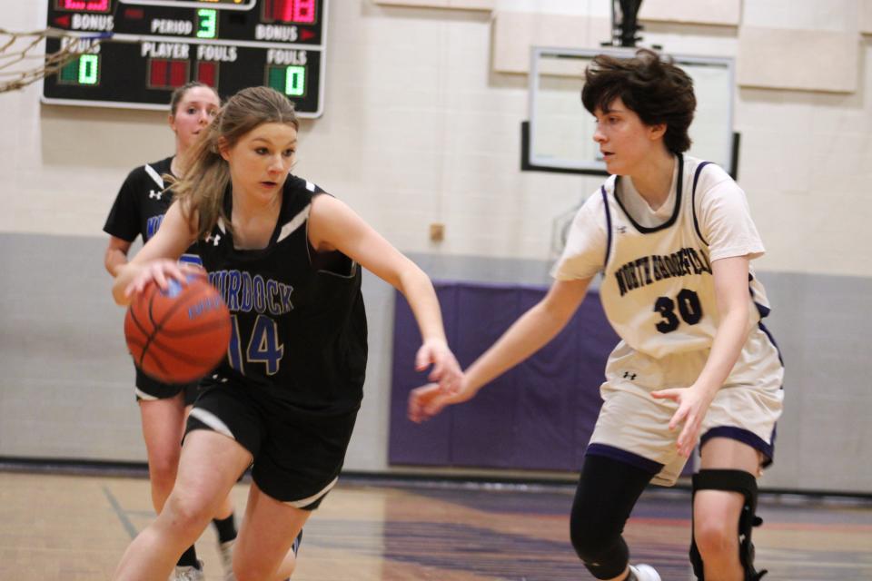 Sadie Bauver drives to the hoop in Murdock's game against North Brookfield on Jan. 11, 2024.