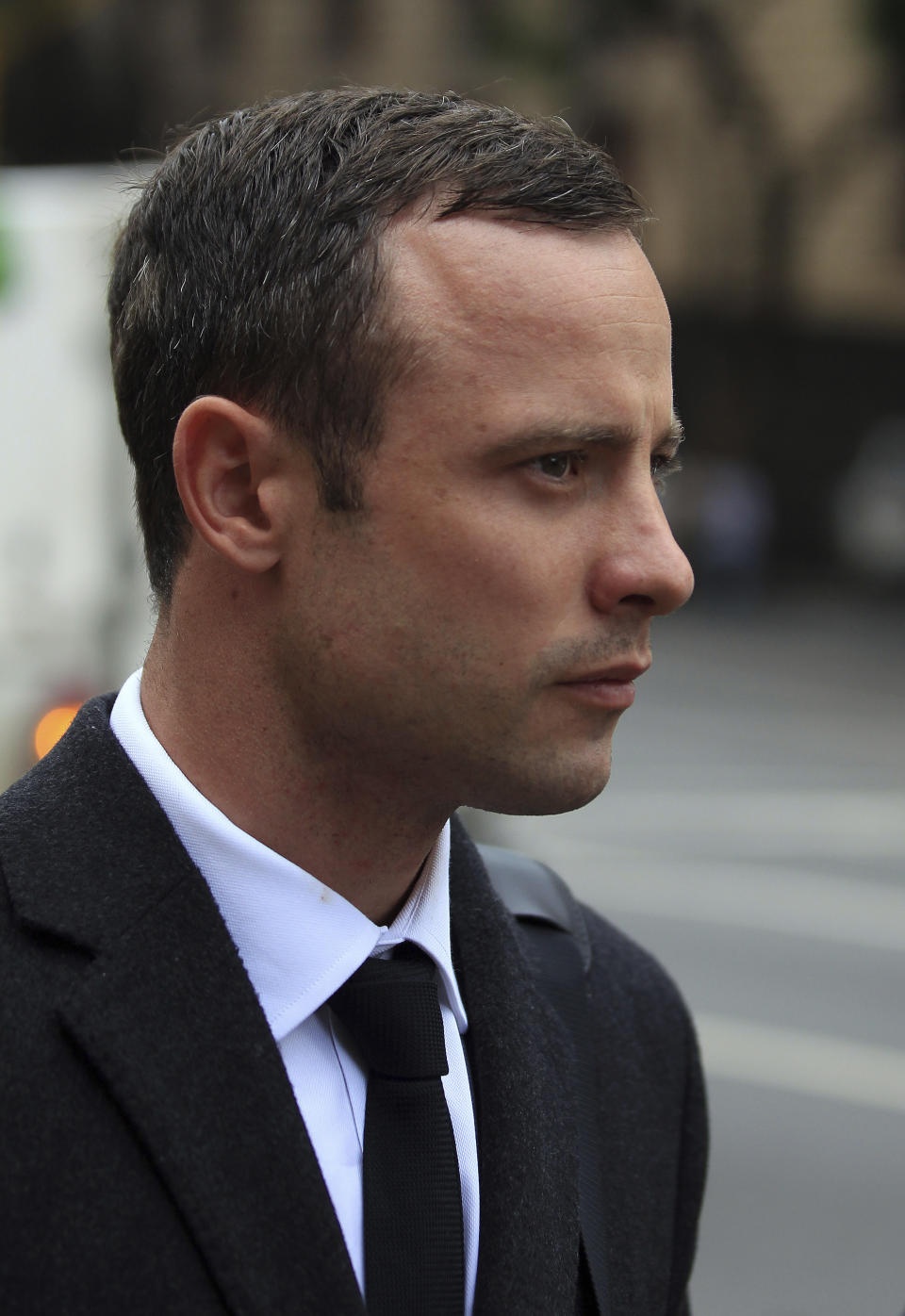 Oscar Pistorius arrives at the high court in Pretoria, South Africa, Monday, March 10, 2014. The testimony in the first week of Pistorius' murder trial was jaw dropping at times, and more riveting evidence is expected as the prosecution seeks to prove beyond reasonable doubt that the double-amputee athlete intentionally shot dead his girlfriend Reeva Steenkamp, on Valentines Day in 2013. (AP Photo/Themba Hadebe)