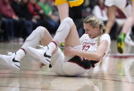 Stanford forward Cameron Brink (22) grimaces after colliding with an Oregon player during the first half of an NCAA college basketball game Friday, Jan. 19, 2024, in Stanford, Calif. (AP Photo/Tony Avelar)
