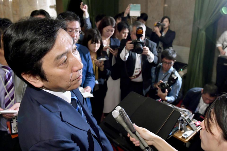 Japanese Trade Minister Isshu Sugawara speaks after a cabinet meeting at parliament in Tokyo Friday, Oct. 25, 2019. A report says Sugawara has offered his resignation on Friday after his office was accused of violating election laws. (Yoshitaka Sugawara/Kyodo News via AP)