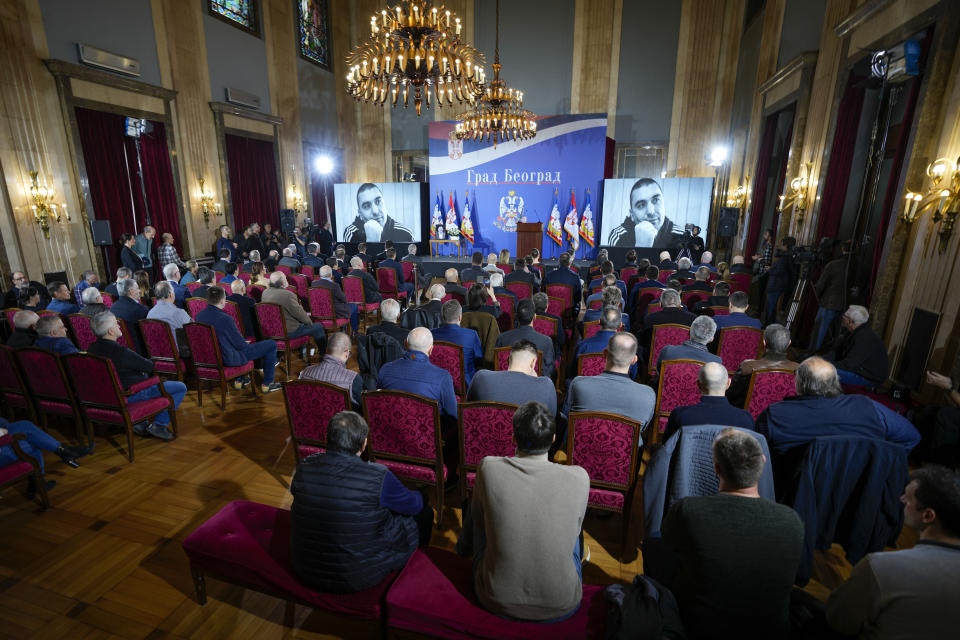 People watch a video tribute for late Golden State Warriors assistant coach Dejan Milojevic during a commemoration ceremony in Belgrade, Serbia, Saturday, Feb. 10, 2024. Milojevic, 46, died on Jan. 17 in Salt Lake City. (AP Photo/Darko Vojinovic)