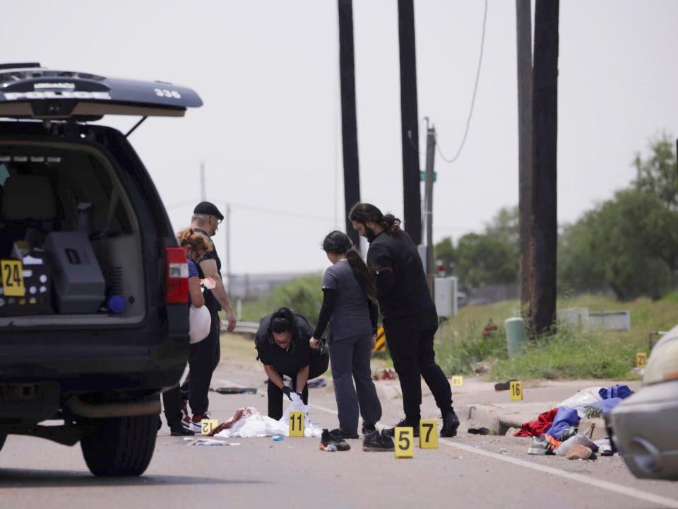 Emergency personnel respond to a fatal collision in Brownsville, Texas, on Sunday, May 7, 2023. Several migrants were killed after they were struck by a vehicle while waiting at a bus stop near Ozanam Center, a migrant and homeless shelter