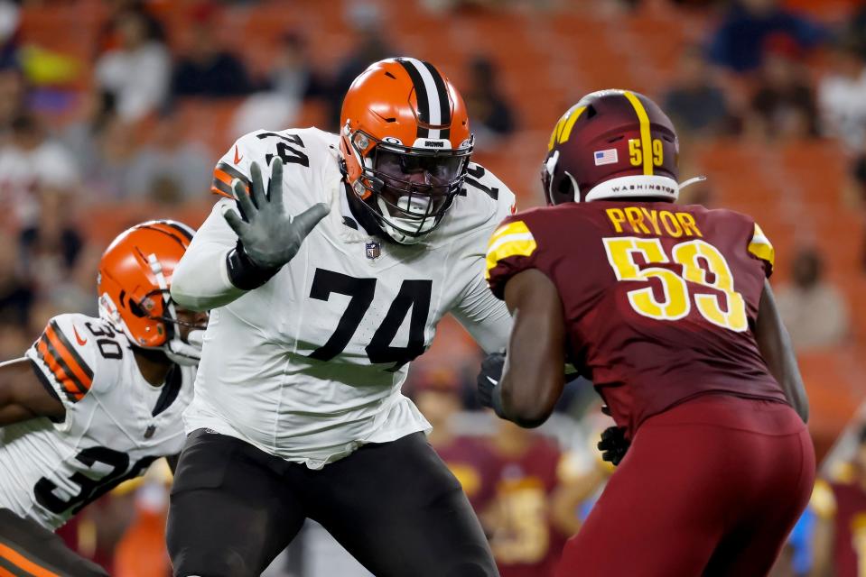 Cleveland Browns offensive lineman Dawand Jones (74) looks to block Washington Commanders defensive end Joshua Pryor (59) during a preseason game Aug. 11 in Cleveland.