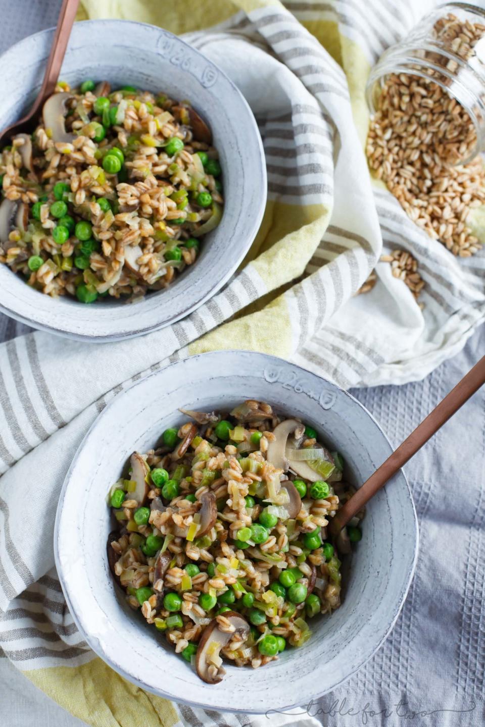 Bowls of leek and mushroom farro with peas