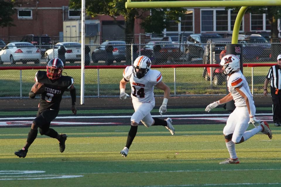 Marion Harding running back Trinity Keith runs for yards against Mount Vernon Friday night in Harding Stadium in the first game of the high school football season.