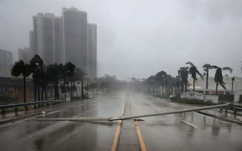 East Oakland Park Boulevard is completely blocked by a downed street light pole as Hurricane Irma hits the southern part of the state - Credit: Getty