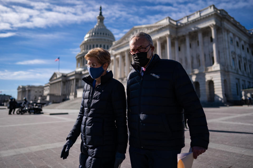WASHINGTON, DC - FEBRUARY 4: Sen. Elizabeth Warren (D-Mass.,) and Senate Majority Leader Sen. Chuck Schumer (N.Y.,) arrive for a news conference on Capitol Hill in Washington, D.C., Thursday, February 4, 2021. The press conference called on President Biden to take action to cancel up to $50,000 in debt for federal student loans by executive action. (Photo by Salwan Georges/The Washington Post via Getty Images)