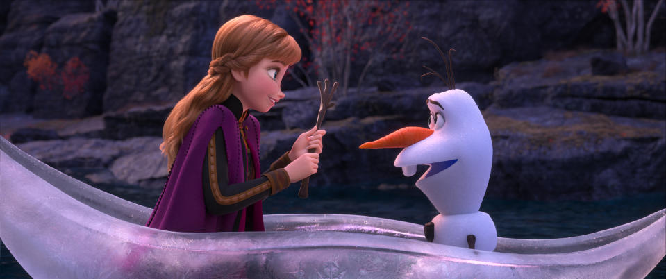 This image released by Disney shows characters Anna, voiced by Kristen Bell, and Olaf, voiced by Josh Gad, in a scene from "Frozen 2." (Disney via AP)