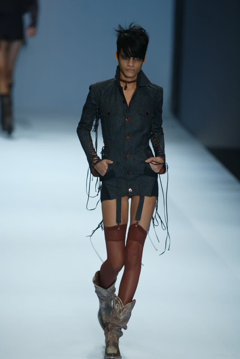 A model walks down the runway at the Spring 2004 Jean Paul Gaultier show in Paris.