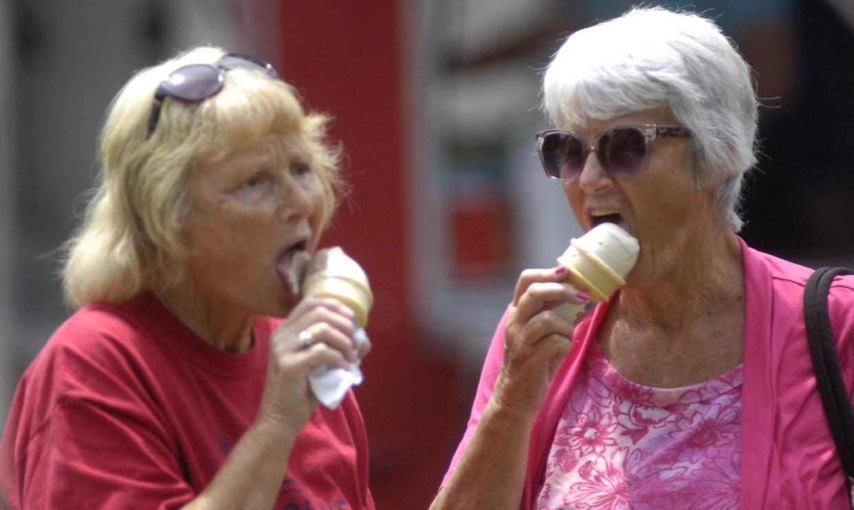 Nancy Grimwood and Becky Thoma enjoy ice cream Sunday afternoon during the Ashland County Historical Society Ice Cream.