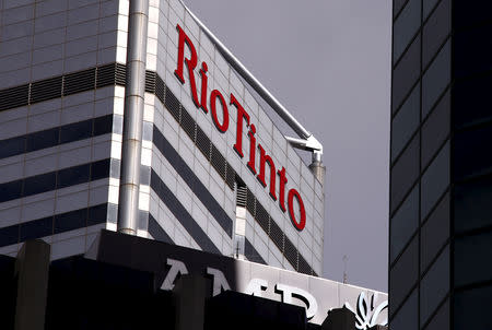 FILE PHOTO: A sign adorns the building where mining company Rio Tinto has their office in Perth, Western Australia, November 19, 2015. REUTERS/David Gray/File Photo