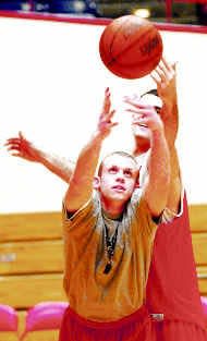 Indiana student manager Dave Pillar battles Kirk Haston for the ball during a break in practice this week. Pillar had been refereeing a scrimmage.