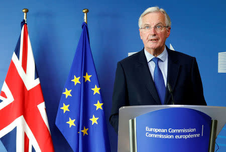 European Union's chief Brexit negotiator Michel Barnier talks to the media next to Britain's Secretary of State for Exiting the European Union David Davis (unseen) ahead of Brexit talks in Brussels, Belgium September 25, 2017. REUTERS/Francois Lenoir