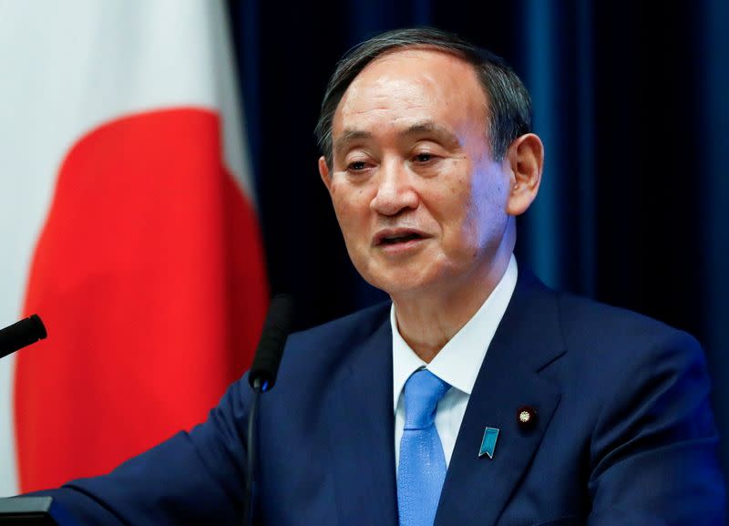 FILE PHOTO: Japan's Prime Minister Yoshihide Suga attends a news conference on Japan's response to the coronavirus disease (COVID-19) outbreak, in Tokyo