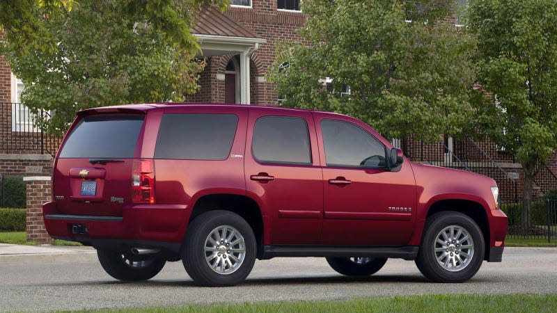 A photo of a red Chevrolet Tahoe from 2008. 