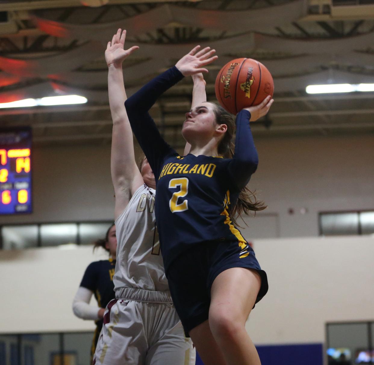 Highland's Grace Koehler goes for a layup against O'Neill's Daisy West during the Section 9 Class B girls basketball championship on February 29, 2024.