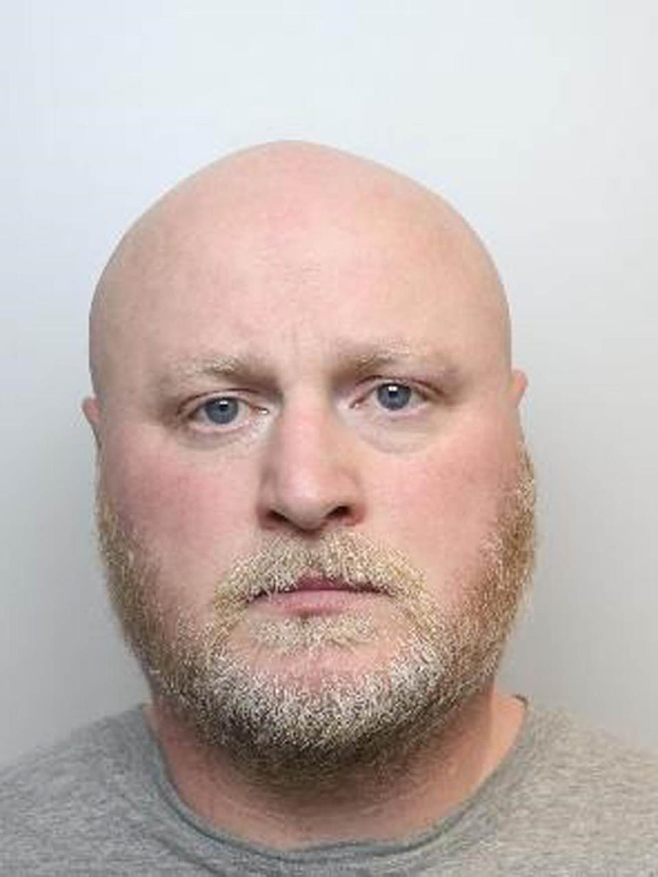 Craig Woodhall is seen in his mugshot.