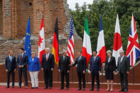 From L-R, European Council President Donald Tusk, Canadian Prime Minister Justin Trudeau, German Chancellor Angela Merkel, U.S. President Donald Trump, Italian Prime Minister Paolo Gentiloni, French President Emmanuel Macron, Japanese Prime Minister Shinzo Abe, Britain’s Prime Minister Theresa May and European Commission President Jean-Claude Juncker pose for a family photo during the G7 Summit in Taormina, Sicily, Italy, May 26, 2017. REUTERS/Philippe Wojazer