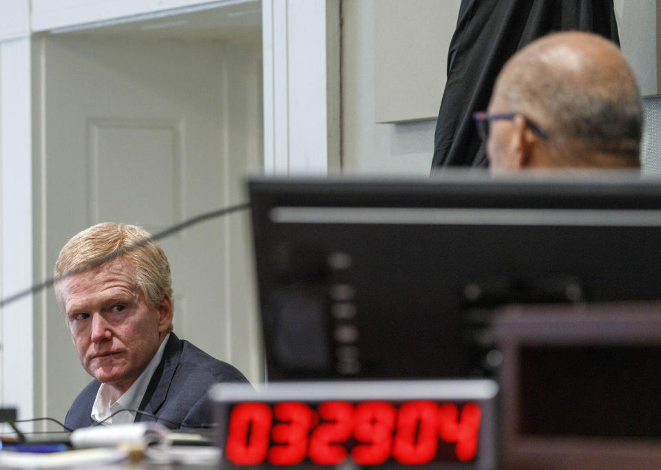 FILE - Judge Clifton Newman, right, addresses Alex Murdaugh, left, who testifies on the stand as the court takes a recess at the Colleton County Courthouse, Feb. 23, 2023, in Walterboro, S.C. On Wednesday, Nov. 1, Murdaugh's lawyers asked the South Carolina Supreme Court to prevent Newman from deciding whether Murdaugh gets a new trial because they accuse a clerk of tampering with the jury and said Newman may be called to testify. (Grace Beahm Alford/The Post And Courier via AP, Pool, File)
