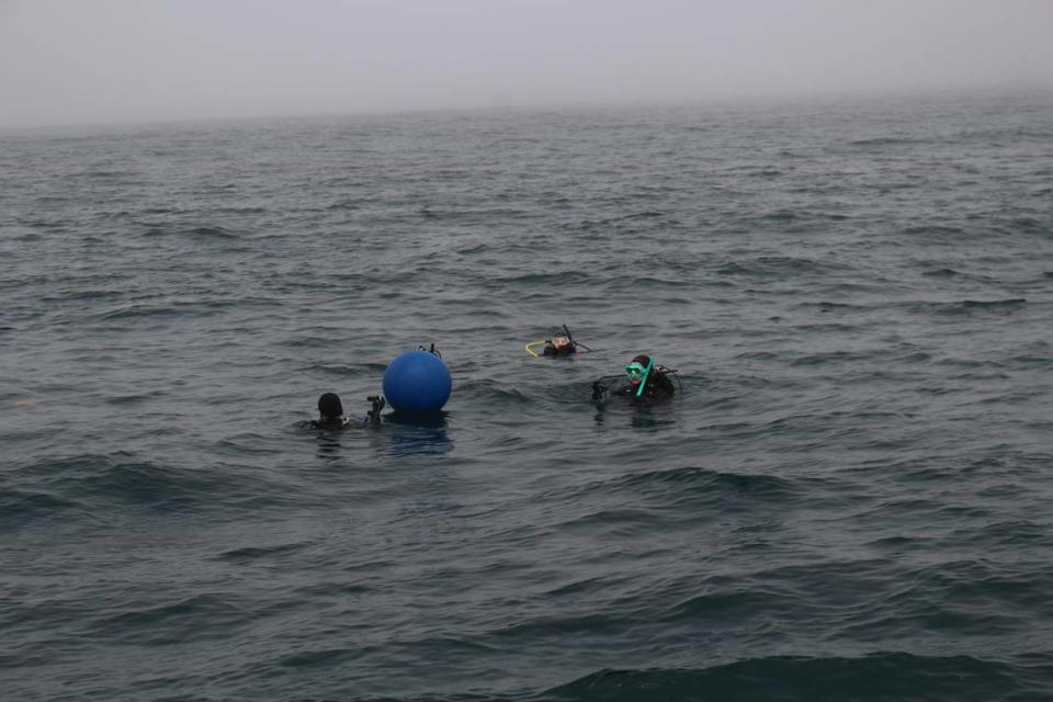 NOAA divers prepare to dive and check out an underwater sound recorder they placed in the proposed Chumash Heritage National Marine Sanctuary on July 12, 2023. Mackenzie Shuman/mshuman@thetribunenews.com