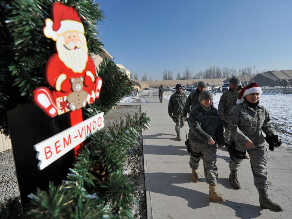 US military personnel walk along their camp as they celebrate Christmas at a US base in Manas, 30 kms from Bishkek, on December 25, 2010. The Manas base in Kyrgyzstan is a major stop-off point for US operations into Afghanistan.