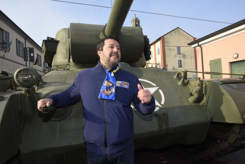 League's leader Matteo Salvini poses next to a tank that was used in an old fiction movie during an electoral rally, in Brescello, central Italy, Sunday, Jan. 12, 2020. (Stefano Cavicchi/LaPresse via AP)