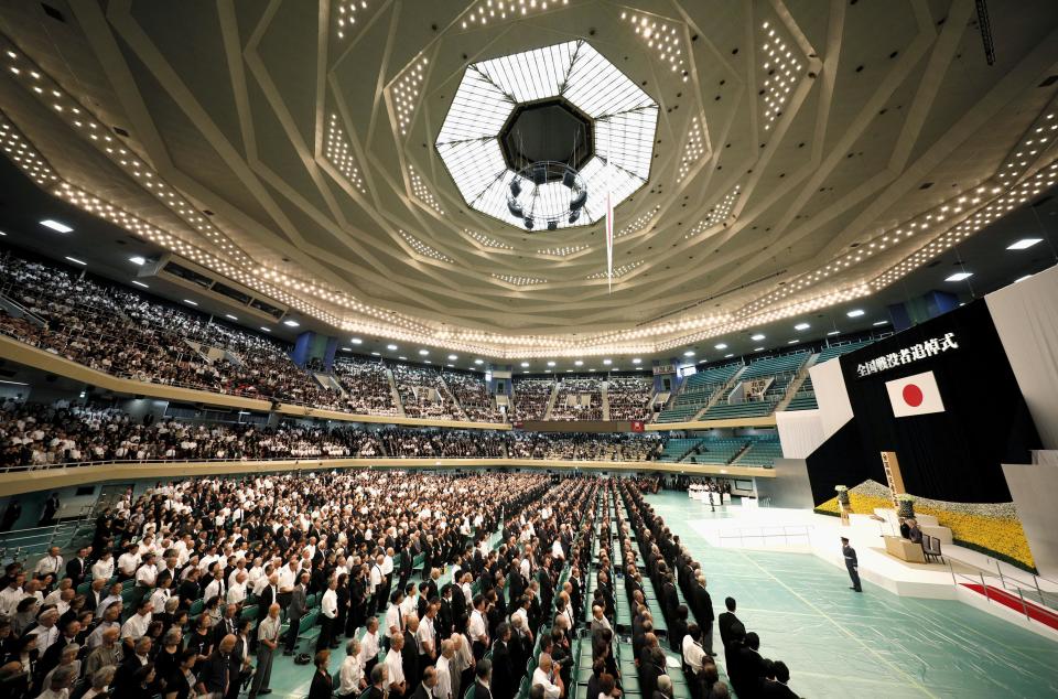 The memorial service for the war dead at Nippon Budokan martial arts hall is seen Wednesday, Aug. 15, 2018, in Tokyo. Emperor Akihito has expressed deep remorse over his country's role in World War II as he made his last appearance at a ceremony marking the end of the hostilities. (Suo Takekuma/Kyodo News via AP)