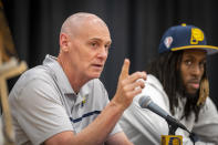 FILE - Indiana Pacers head coach Rick Carlisle, left, responds to questions by the media during an NBA basketball news conference in Indianapolis, in this Friday, July 30, 2021, file photo. Pacers coach Rick Carlisle says his new team has a “very high” vaccination rate but declined to give a specific number because of privacy concerns. He did say Monday during NBA media day that all members of the Indiana coaching staff are fully vaccinated. Carlisle is back in Indiana, where he coached from 2003 through 2007. Training camps open Tuesday and the pandemic will affect a third NBA season and already means some players will be missing on media day.(Doug McSchooler/The Indianapolis Star via AP, File)