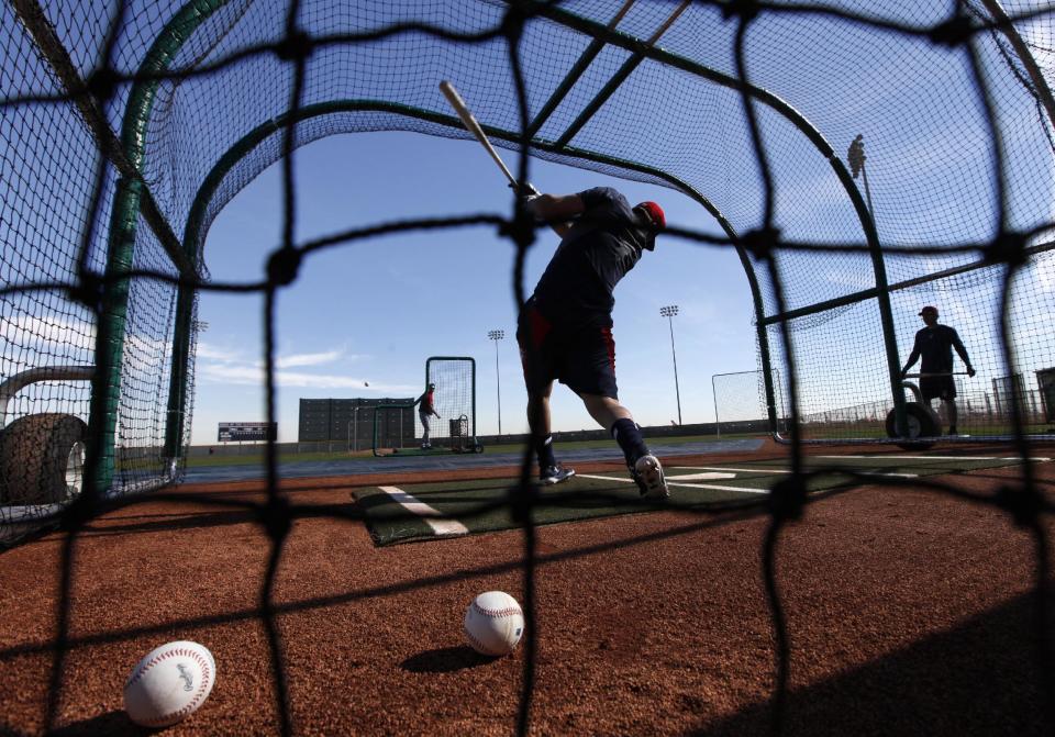 Cleveland Indians' Jeff Francoeur bats during spring training baseball practice in Goodyear, Ariz., Thursday, Feb. 13, 2014. (AP Photo/Paul Sancya)