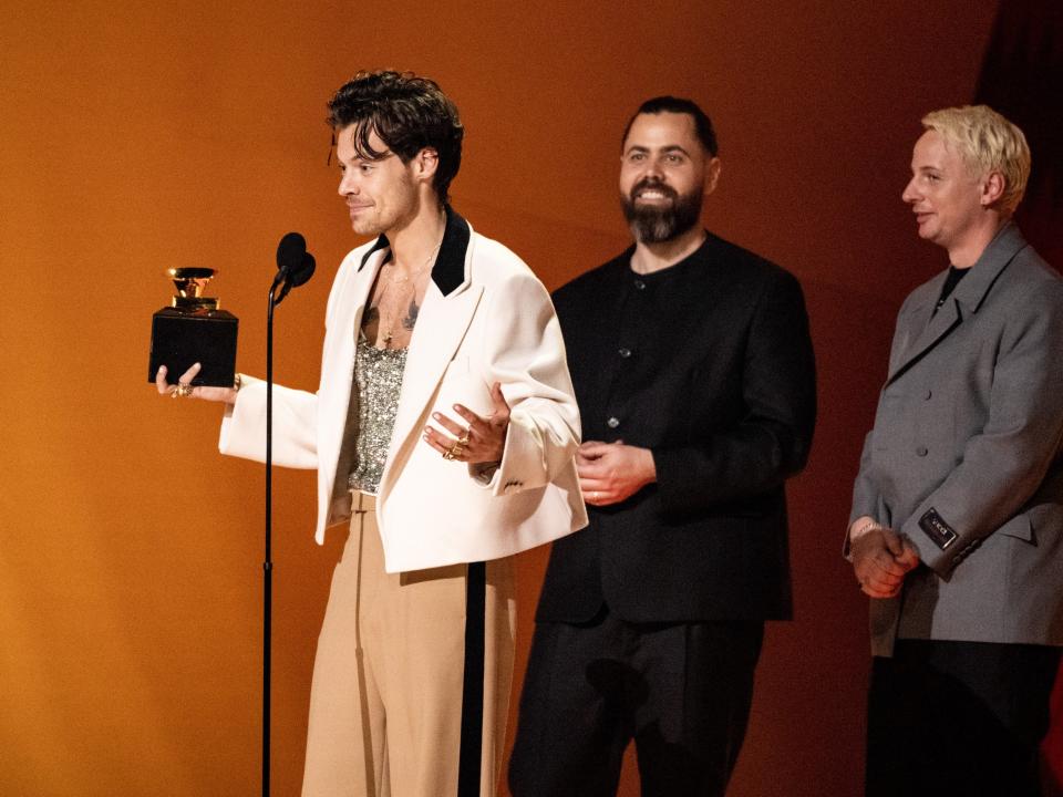 Harry Styles accepting his AOTY Award.