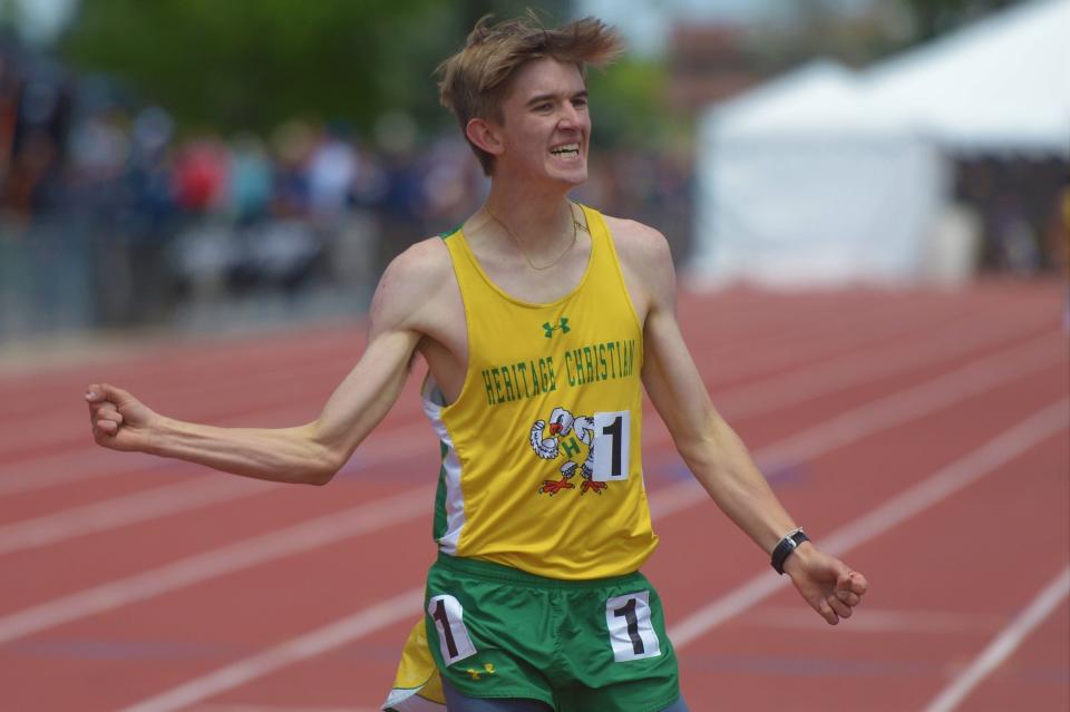 Heritage Christian runner Jack Nauman celebrates after winning the 1A 1,600-meter run during the Colorado high school state track and field meet at Jeffco Stadium in Lakewood on Sunday, May 22, 2022.