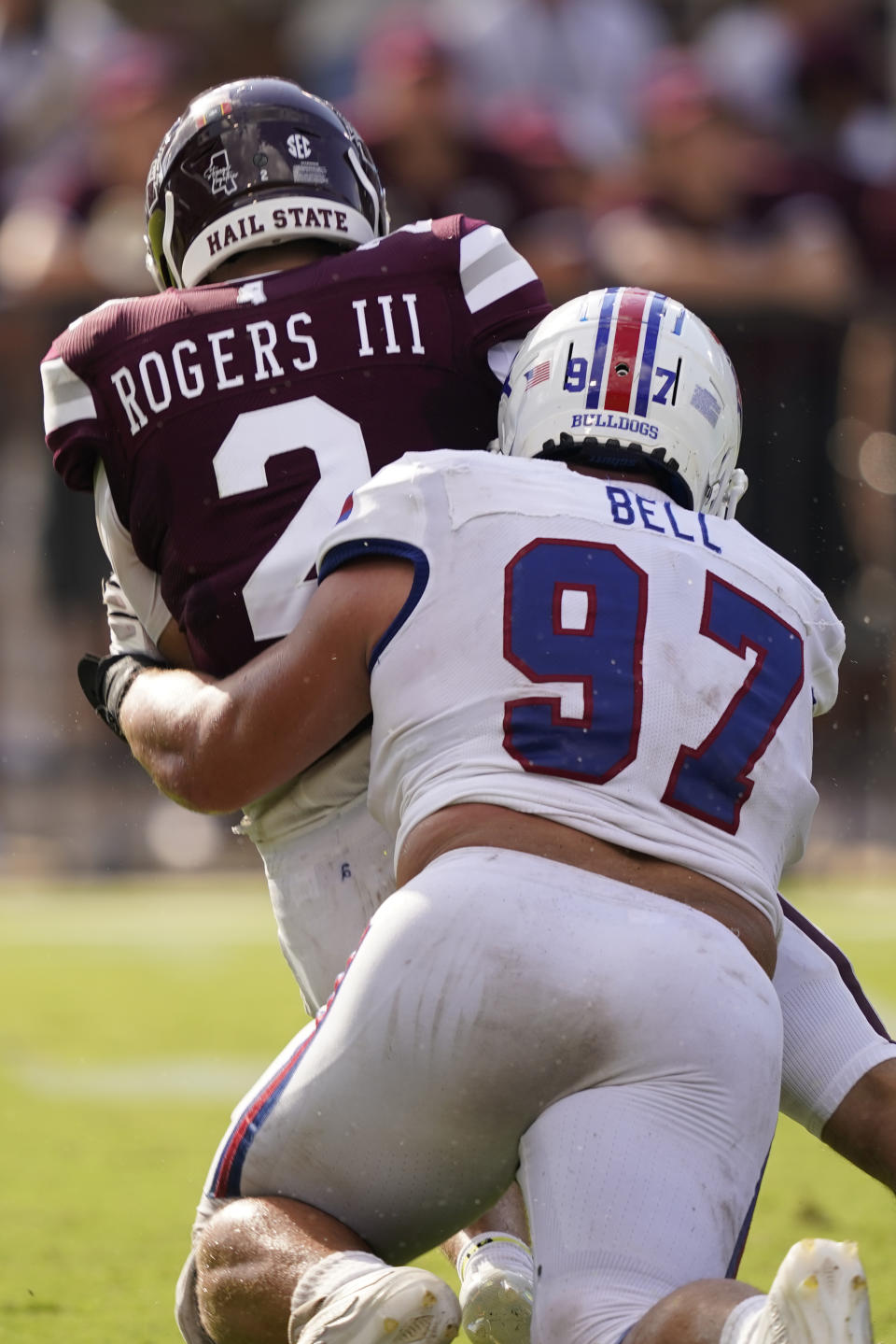 Mississippi State quarterback Will Rogers (2) is sacked by Louisiana Tech defensive lineman Levi Bell (97) during the first half of an NCAA college football game in Starkville, Miss., Saturday, Sept. 4, 2021. (AP Photo/Rogelio V. Solis)