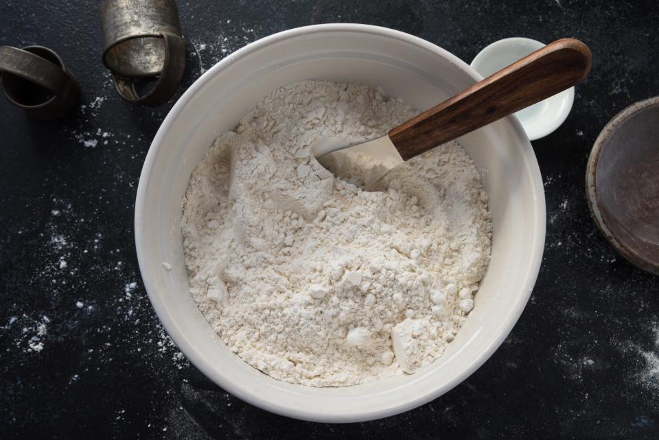 Bowl of flour on table