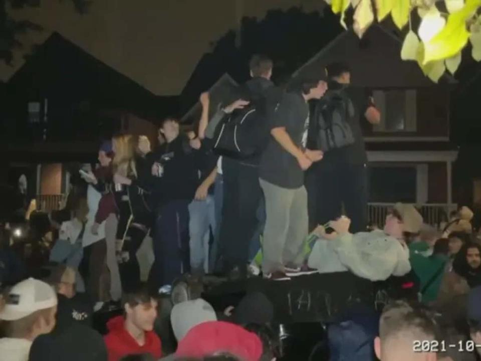 Partygoers flipped a car on Russell Avenue after the Panda Game on Oct. 2. (Radio-Canada - image credit)